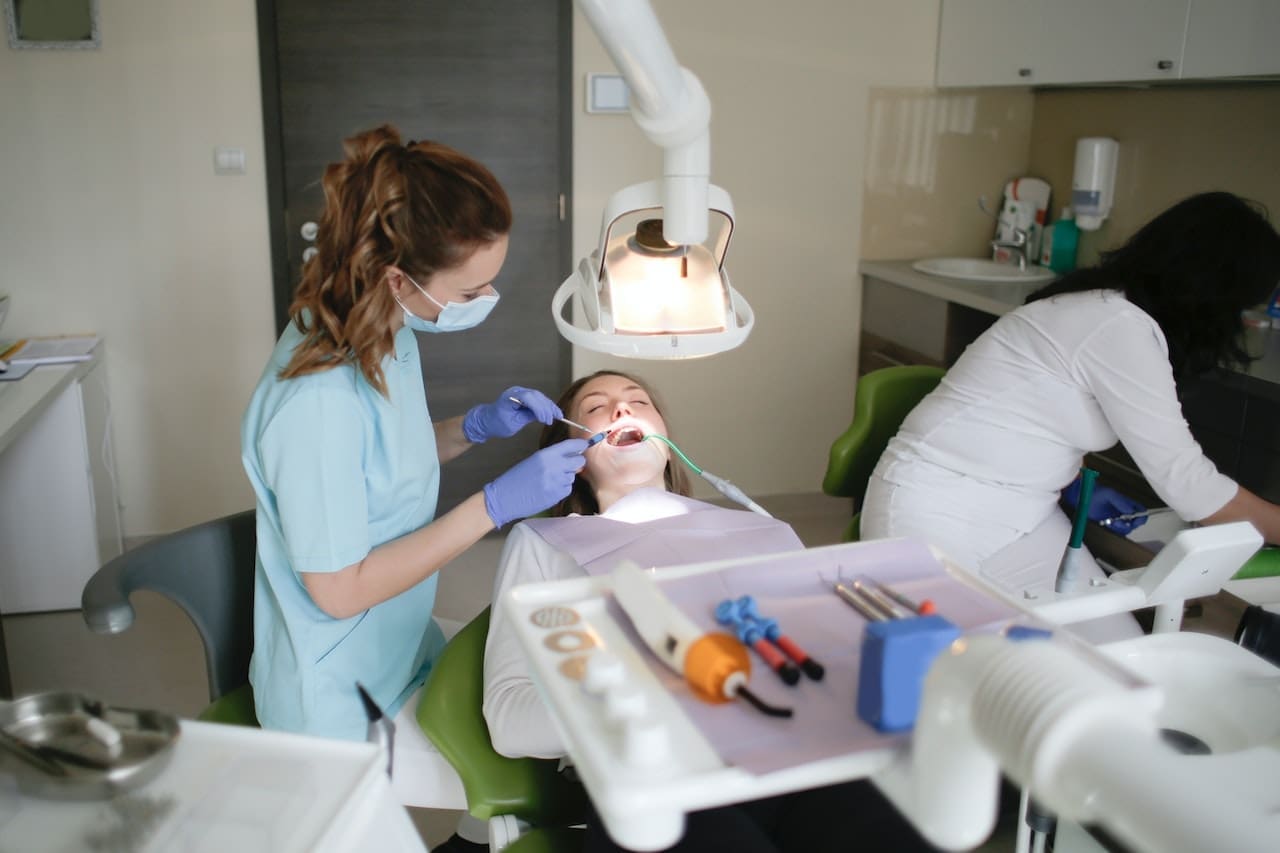 Woman in dental chair receiving a laser treatment for lip and tongue tie in Lexington