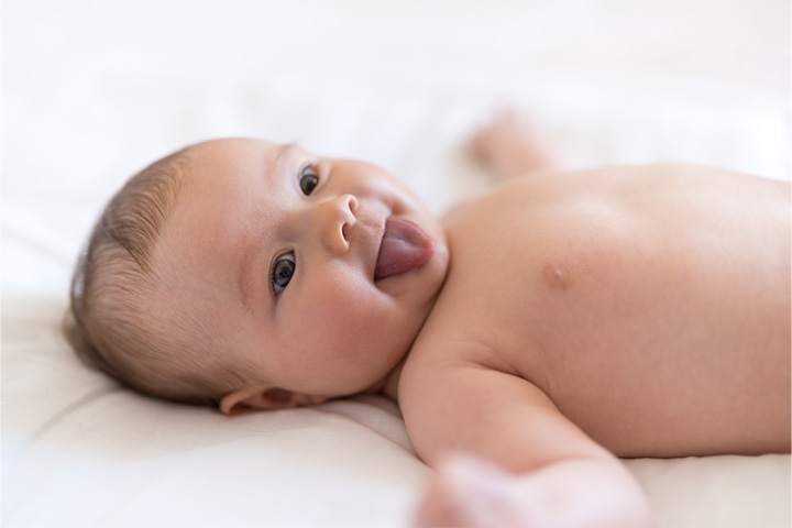 Happy baby sticking out its tongue