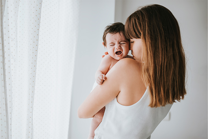 Mother trying to comfort crying child