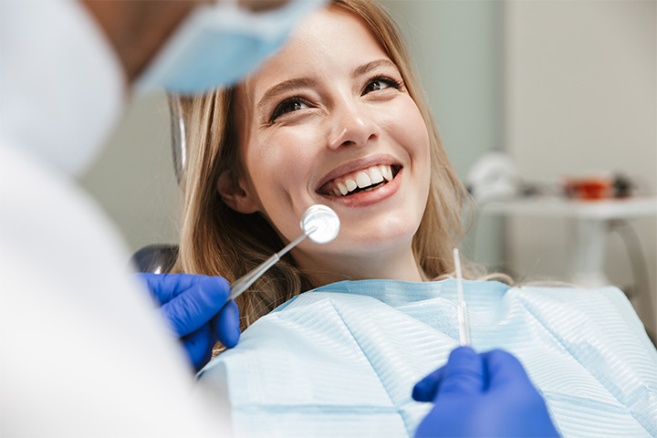 A pretty woman smiling at her dentist
