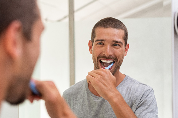 Patient in Lexington brushing teeth