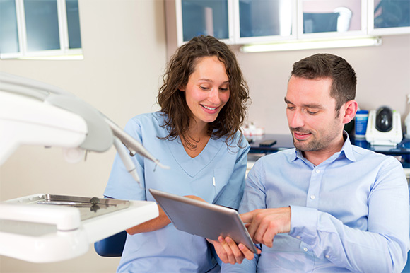 Patient in Lexington smiling at dentist
