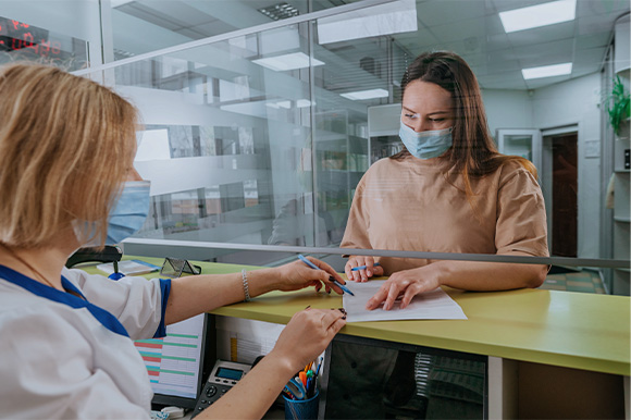 Patient in Lexington talking to dental team about financing options 