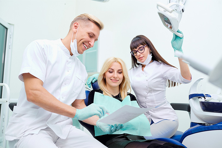Dentist discussing the cost of a dental crown in Lexington.