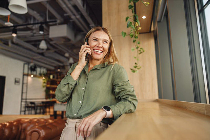 Lady makes business call on phone.
